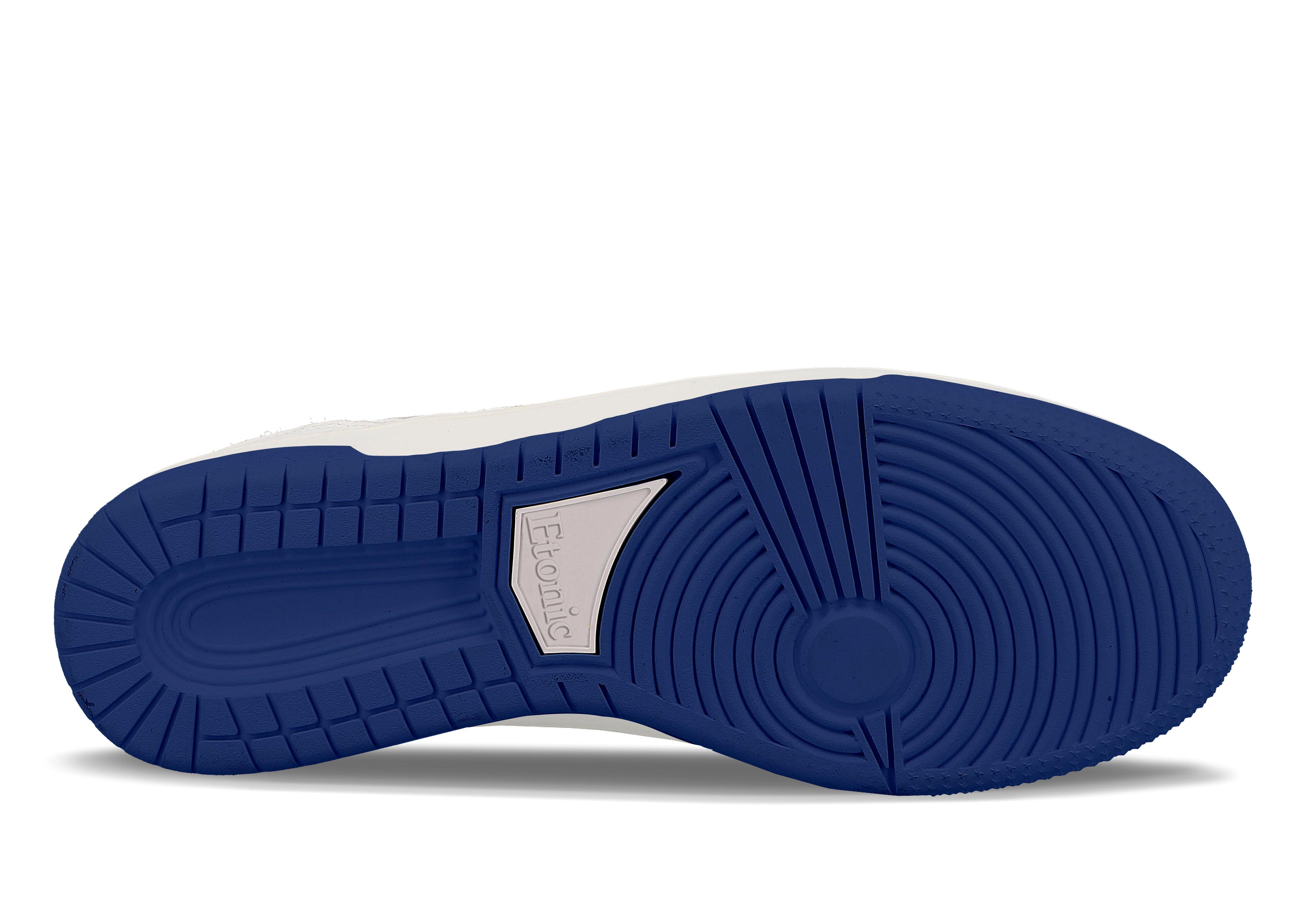 Baskets Etonic B509 en cuir blanc avec col en toile blanche et détails bleu électrique