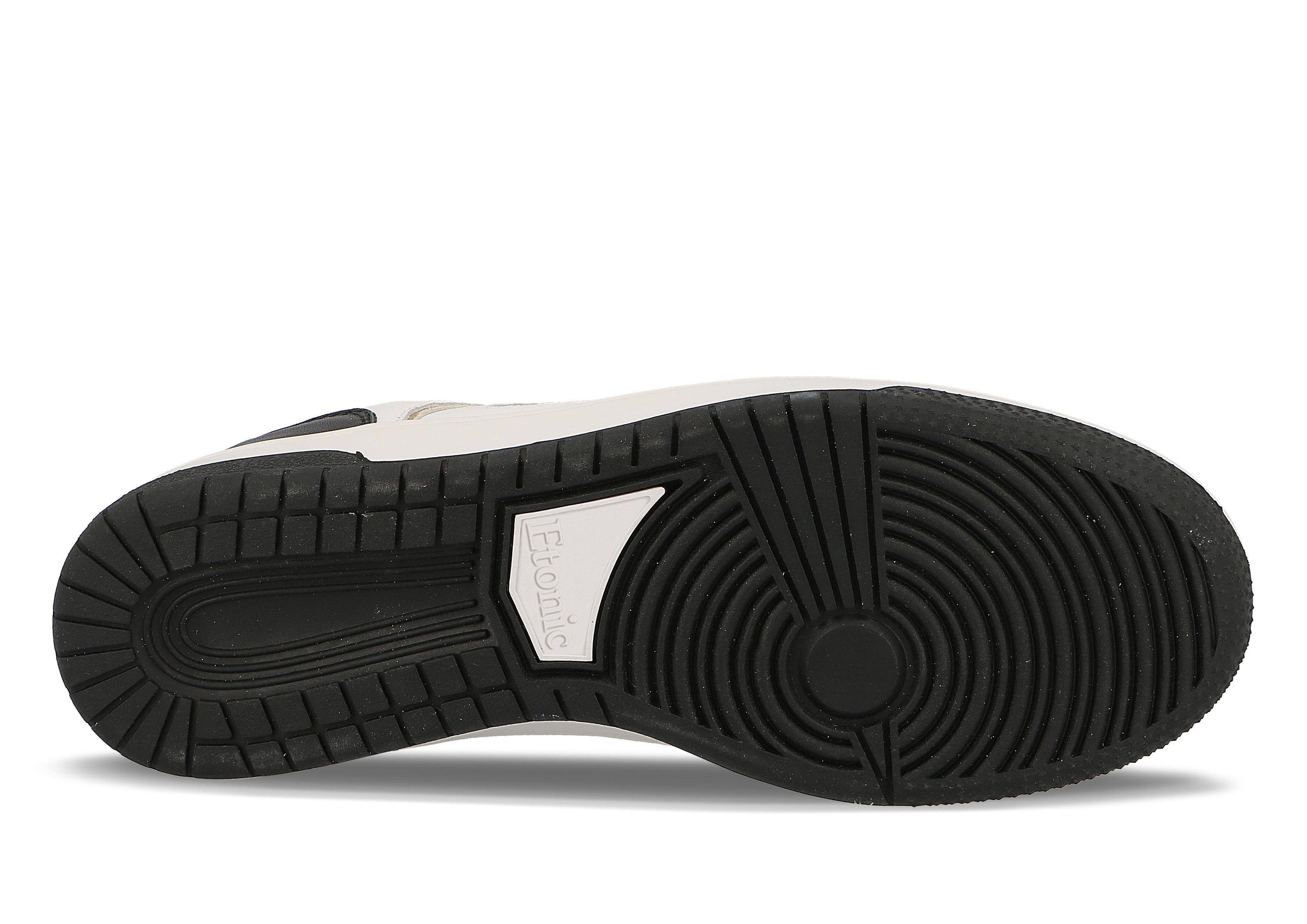 Baskets Etonic B509 en cuir blanc avec col en toile blanche, détails noirs et dorés et languette en mesh blanc