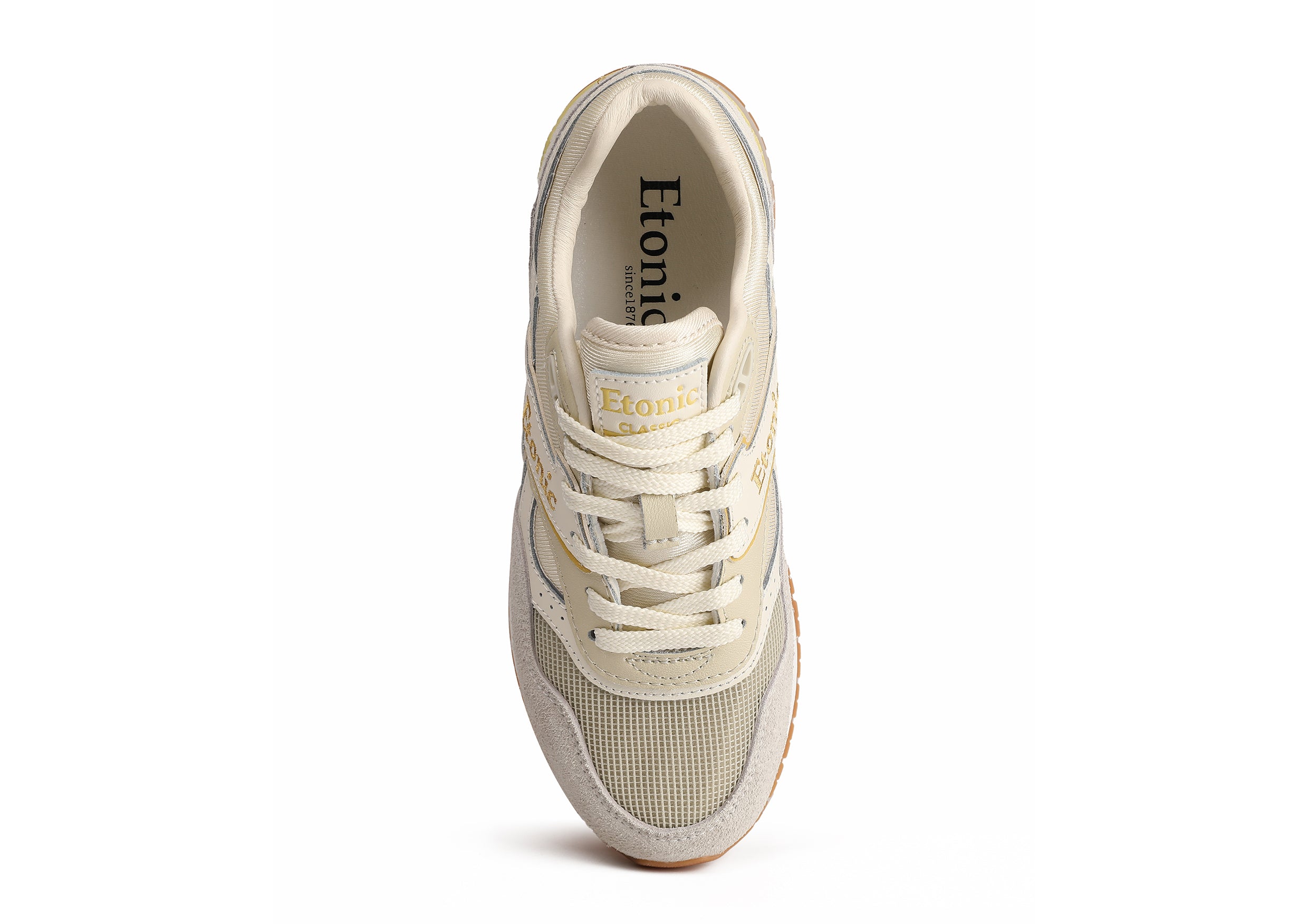 Sneakers Etonic Stable Base in tessuto mesh beige, suede peloso grigio con inserti multistrato in pelle bianco sporco, intersuola bianca e suola fondo miele chiaro.