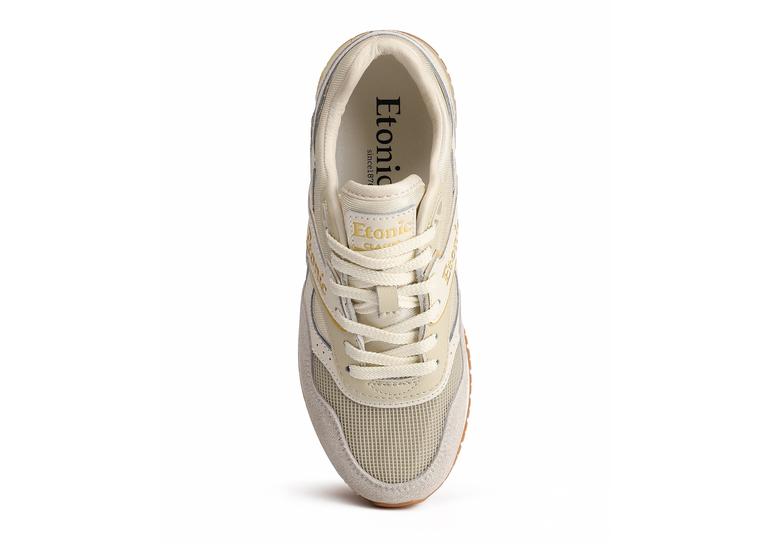 Sneakers Etonic Stable Base in tessuto mesh beige, suede peloso grigio con inserti multistrato in pelle bianco sporco, intersuola bianca e suola fondo miele chiaro.
