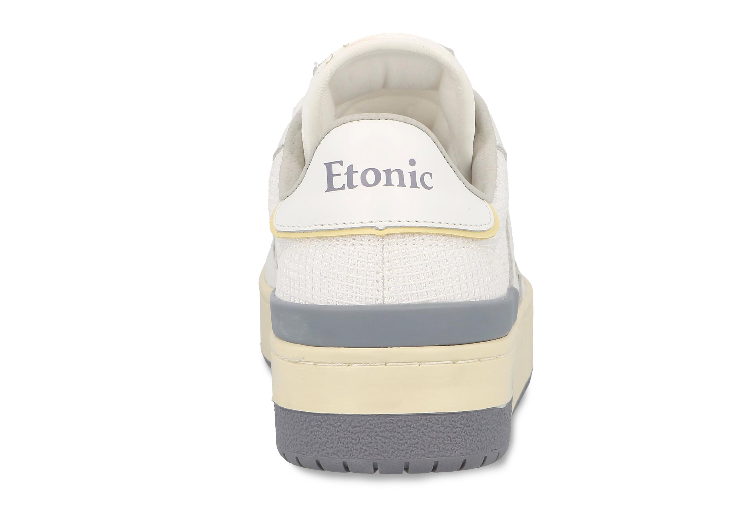 Sneakers Etonic B481 in pelle bianca, mesh bianco, dettagli gialli e verde grigio fumo con intersuola beige e suola inferiore grigio fumo.