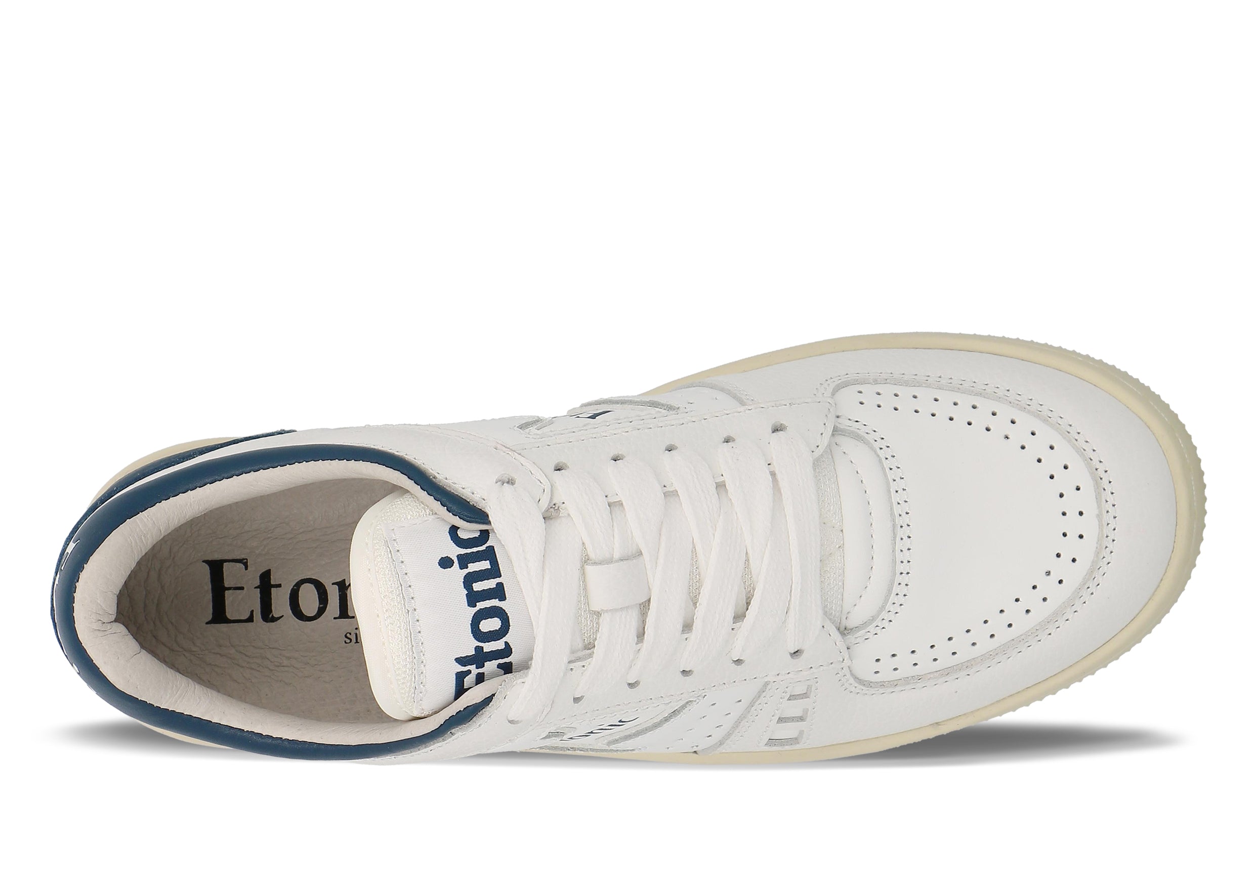 Sneakers Etonic B509 in pelle bianca con dettagli blu scuro e suola beige.