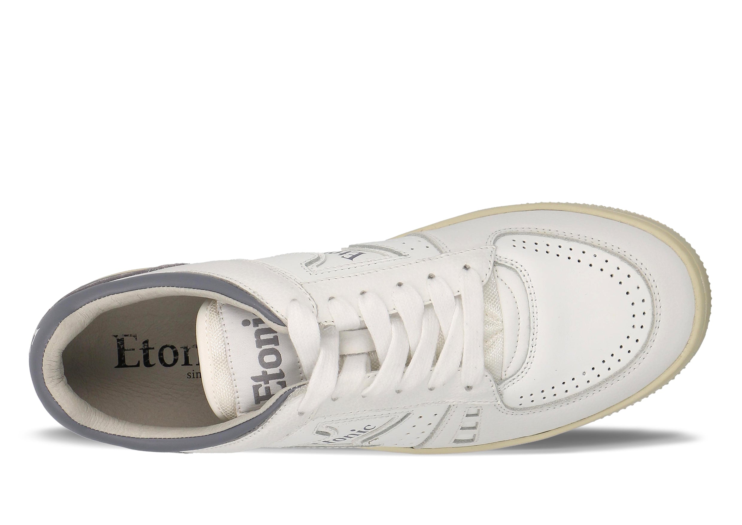 Sneakers Etonic B509 in pelle bianca con dettagli lilla scuro e suola beige.